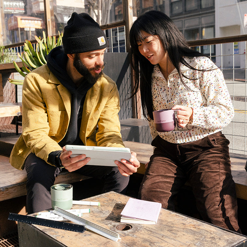 12oz-rise-mug-e6 12oz_rise_coffee_mug_dusty_orchid_couple_city_patio_square.jpg