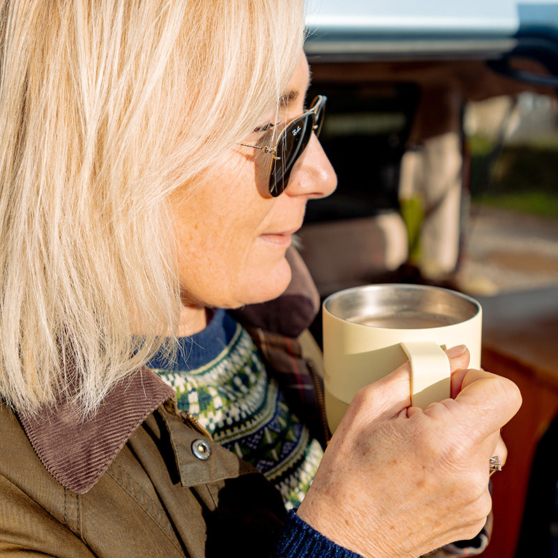 12oz-rise-mug-e6 12oz_rise_coffee_mug_wax_yellow_woman_drink_closeup_square.jpg