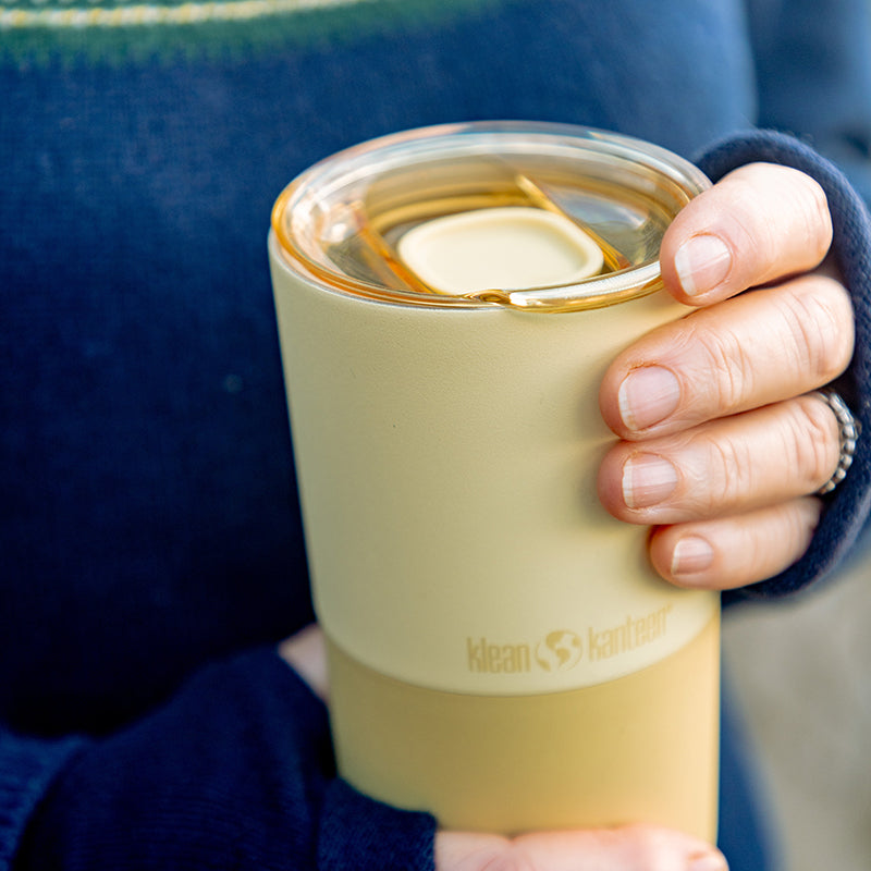 daily-on-the-go-set-a7 16oz_rise_tumbler_wax_yellow_closeup_hand_lid_square.jpg