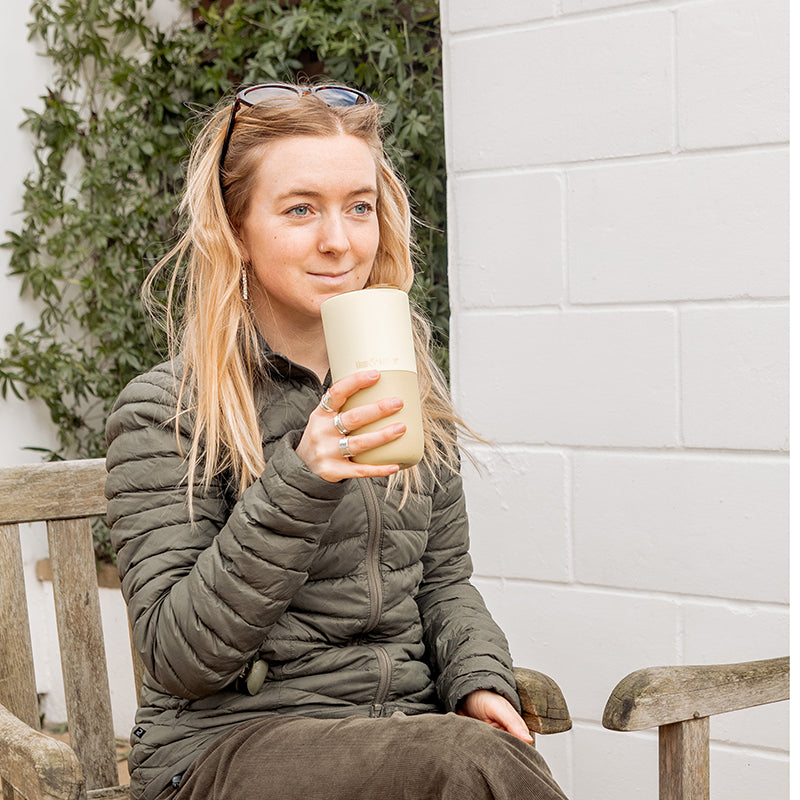 16oz-rise-tumbler-h4 16oz_rise_tumbler_wax_yellow_woman_seat_outside_square.jpg