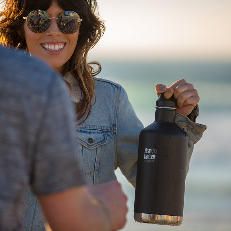 64oz-classic-with-loop-cap-p3 64oz_insulated_classic_black_beach_girl_hand_square.jpg