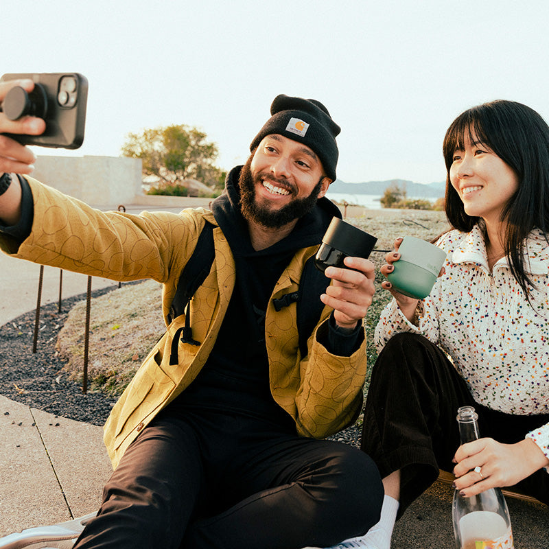 bring-your-own-party-kit-tumblers-and-cocktails-b0 8oz_rise_lowball_black_iceberg_couple_selfie_city_square.jpg